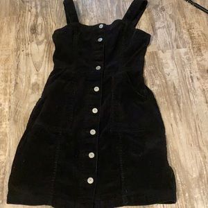 Worn black corduroy dress